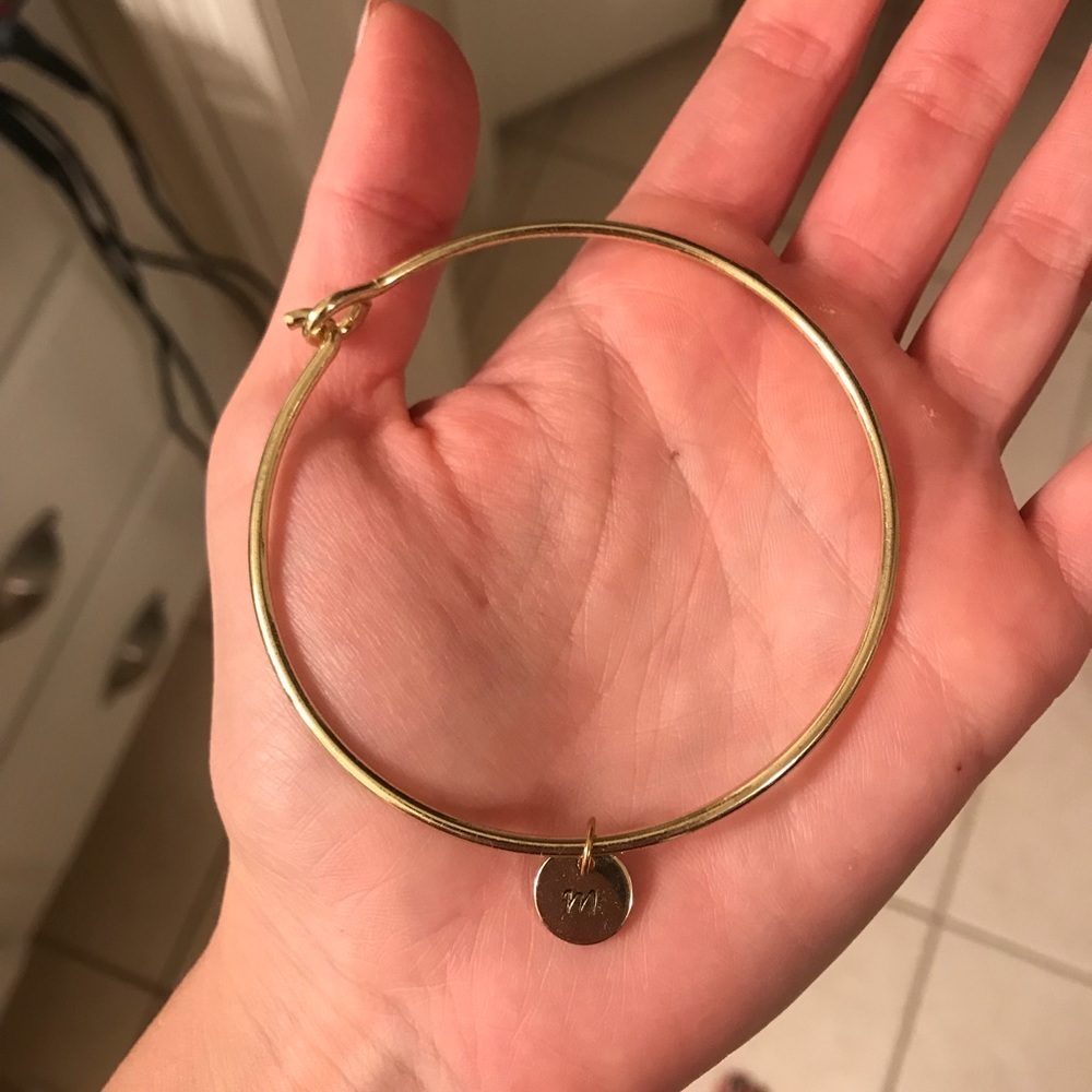 Gold bracelet with M charm